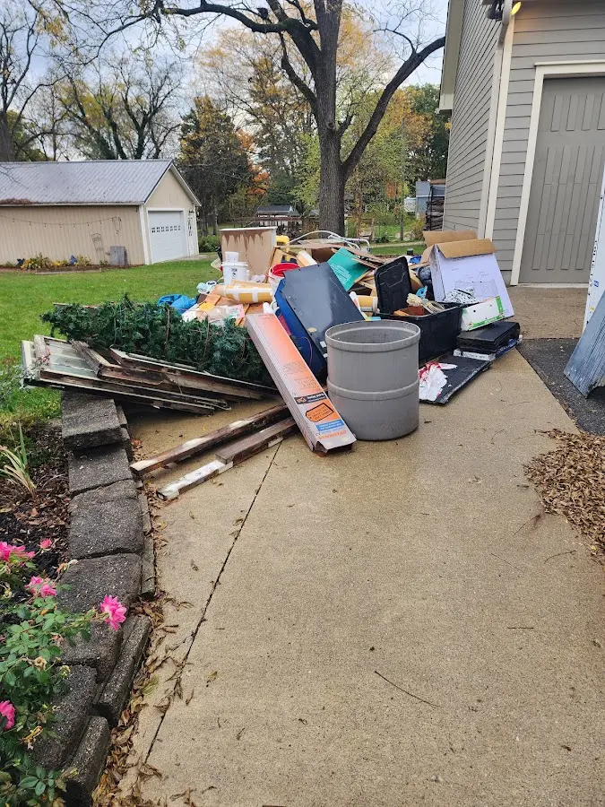Dumpster being loaded with debris for Roofing Dumpster Rental in Captain Cook